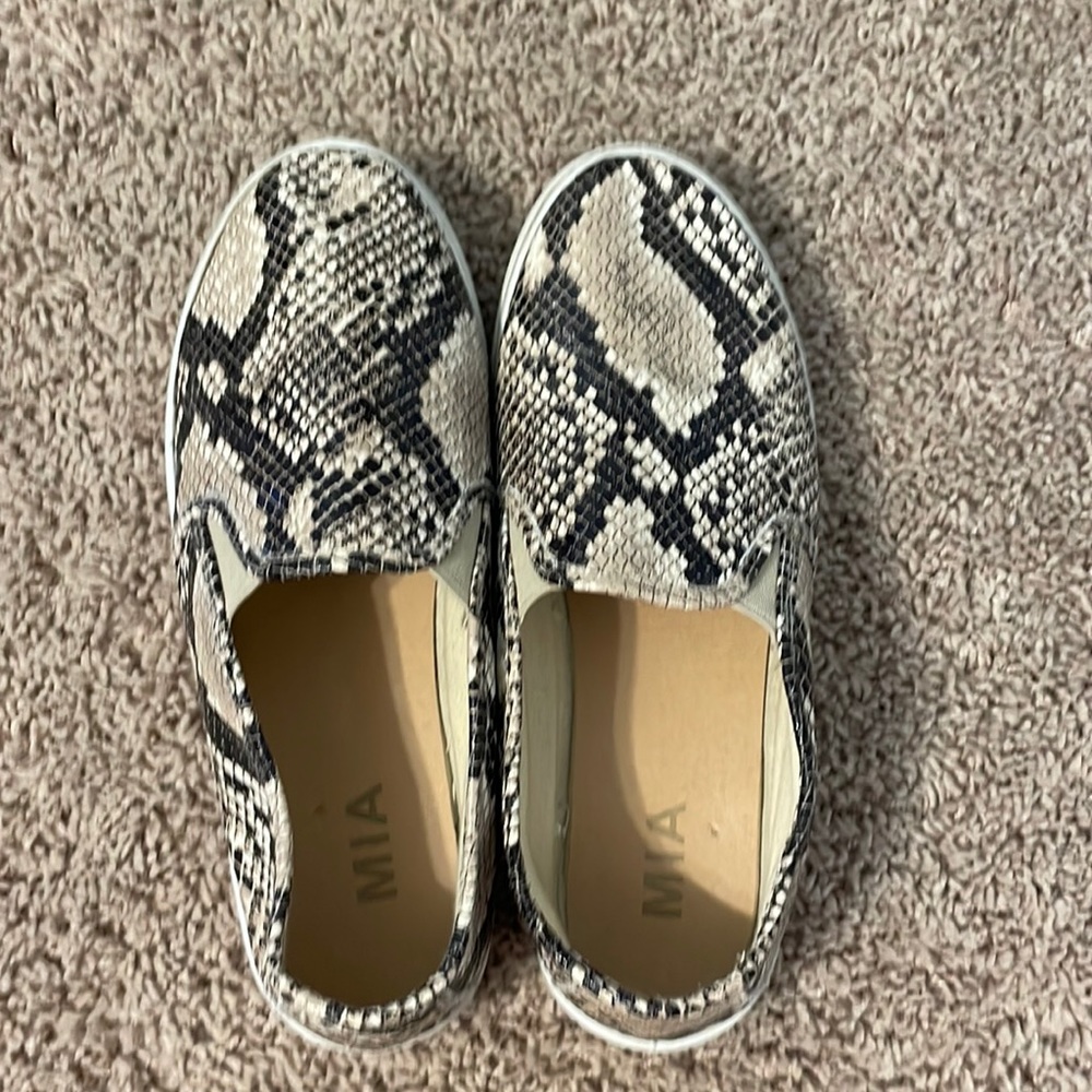 Snake print flats.